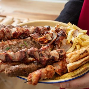 Grill meat skewer, Souvlaki chicken and pork, kebab doner served in a plate, close up. Greek food