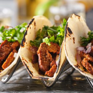 metal taco holder with three mexican carne asada street-tacos